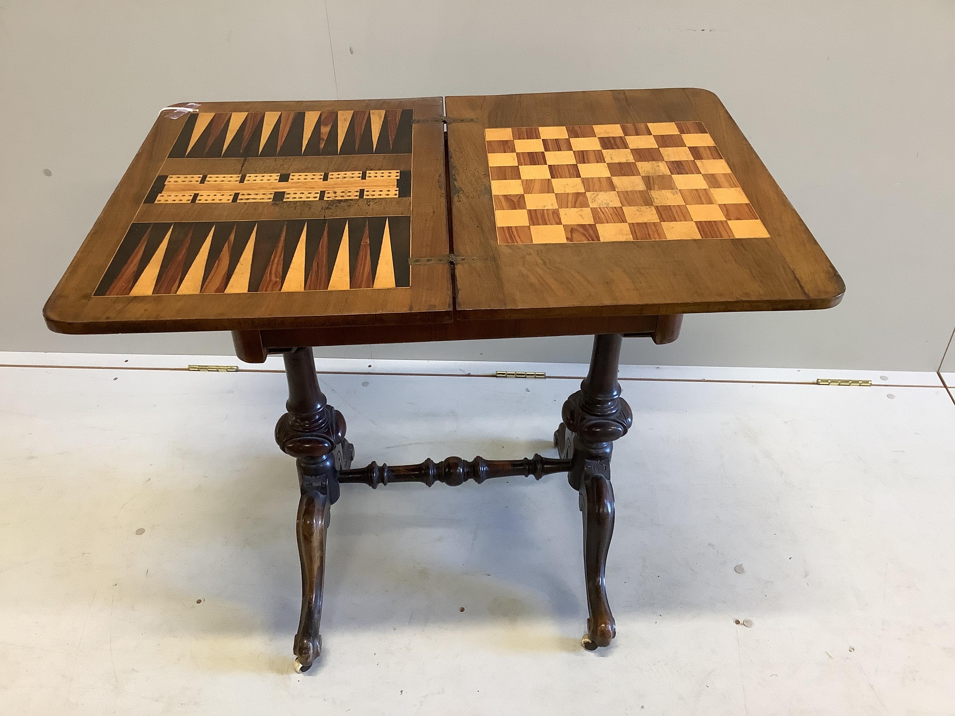 A Victorian walnut rectangular folding games table, width 54cm, depth 40cm, height 72cm